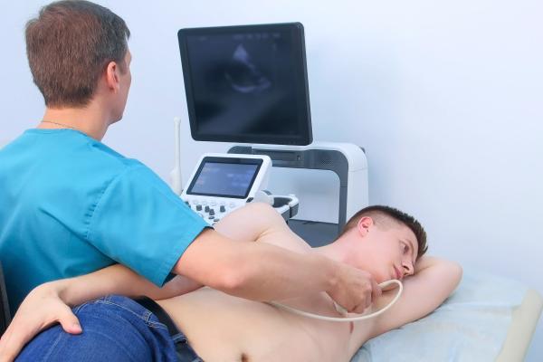 technician doing chest scan